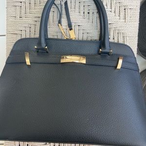 Calvin Klein Bag Black with Gold accents. NWOT